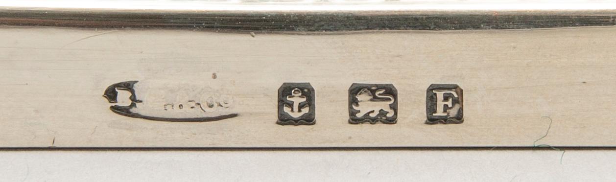 A pair of classical column sterling silver candlesticks Birmingham, 1934, by 'B.G. & Co'.
