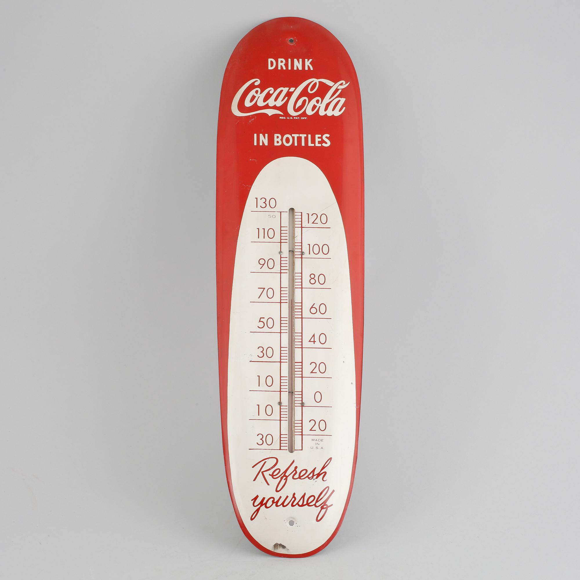 A Coa-Cola thermometer from the mid 20th century.