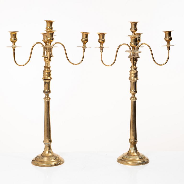 A pair of brass candelabra, model N12, Nyköpings Bruk, Sweden, around 1900.