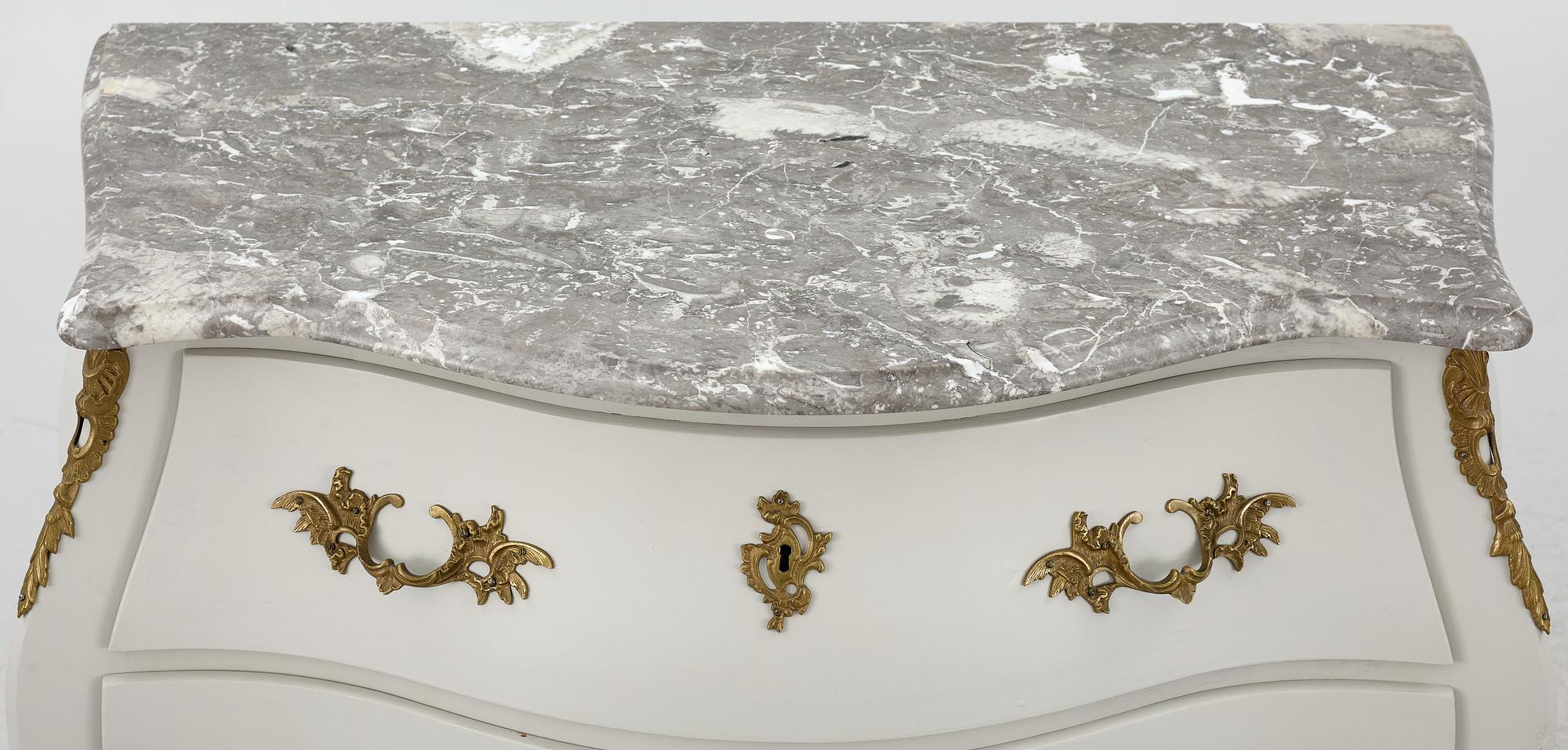 A Rococo style chest of drawers, mid-20th Century.