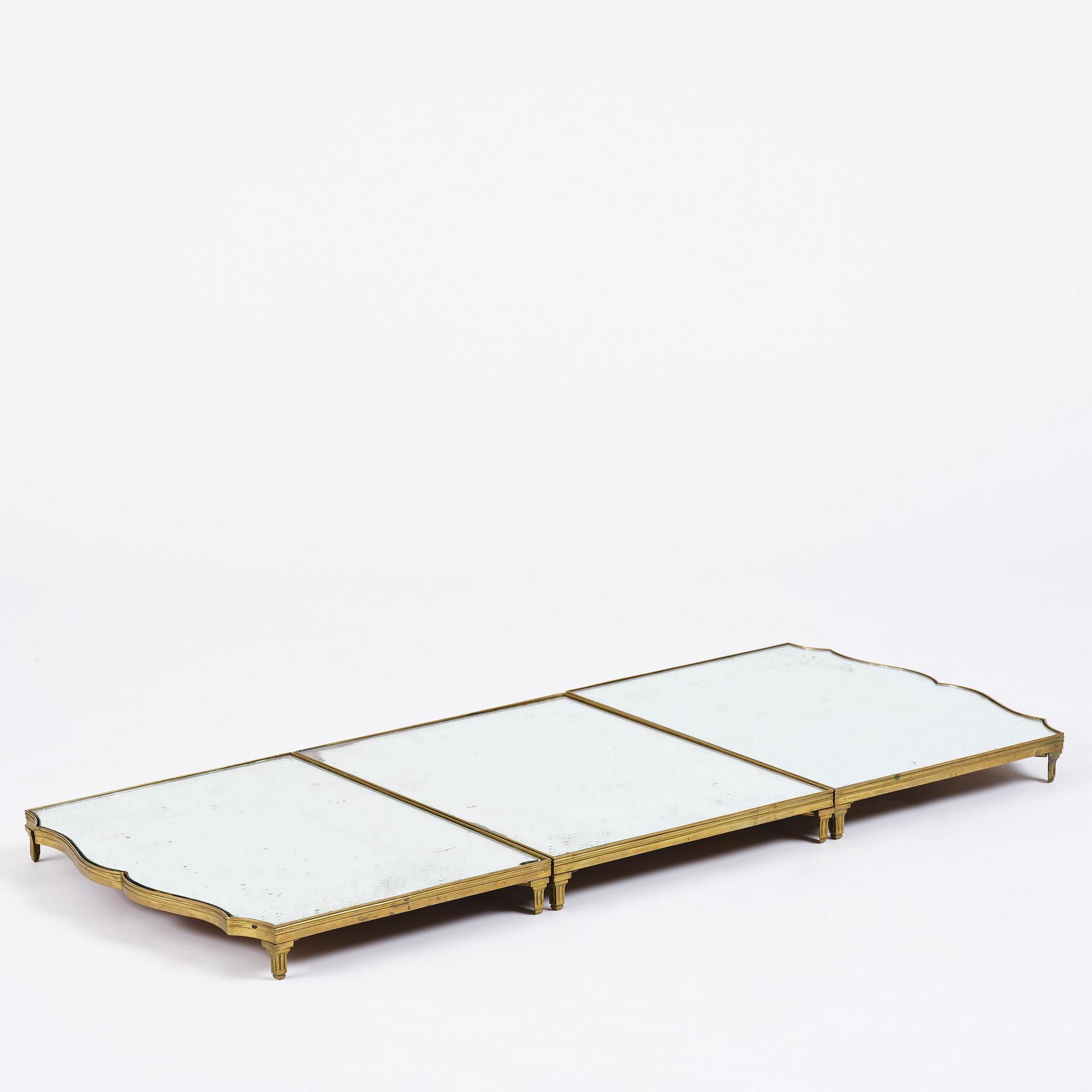 A Gustavian three-piece brass and glass surtout de table, Stockholm, later part 18th century.