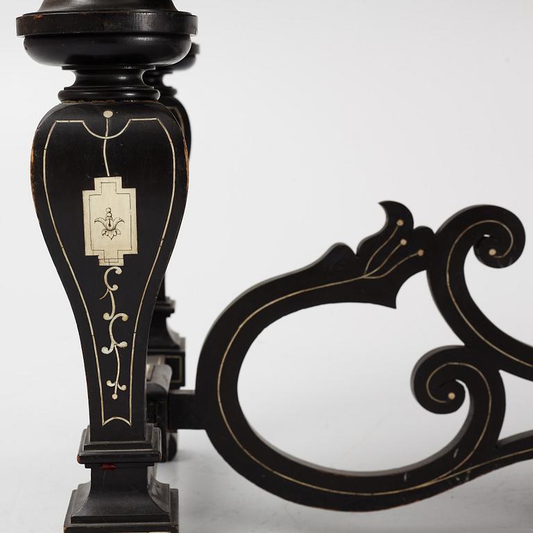 A Renaissance-style ebony, ebonized and ivory-inlaid library table, late 19th century, presumably Germany.