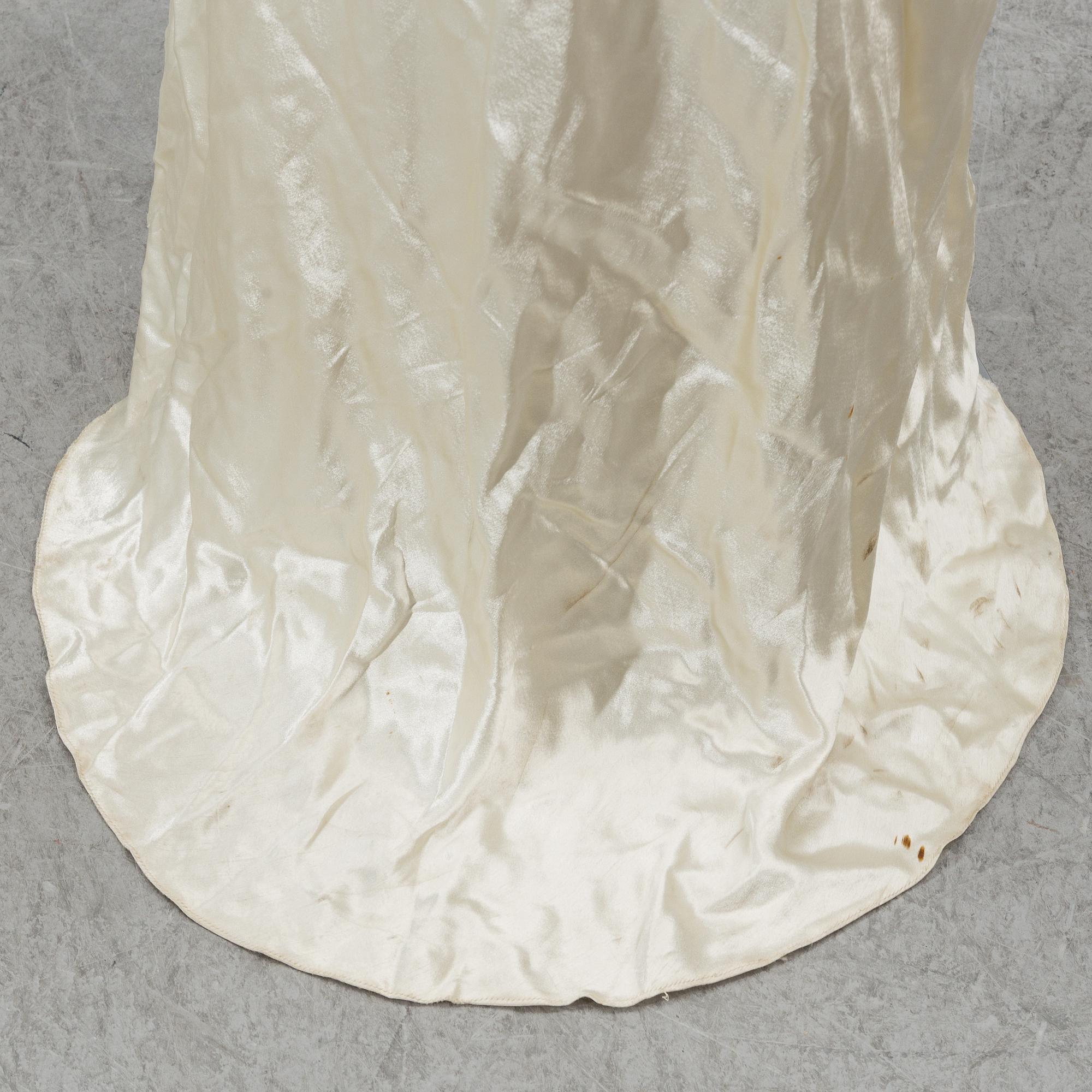 A satin wedding dress, circa 1935.