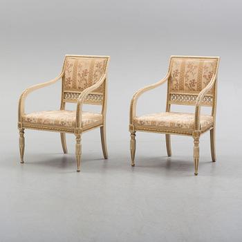 A pair of first half of the 19th century Empire arm chairs.
