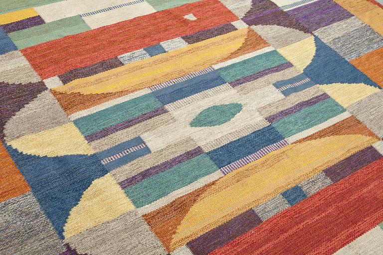 A CARPET, flat weave, ca 449 x 242,5 cm, signed MG, dated 1969.