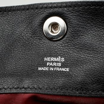 HERMÈS, a black leather small bag.