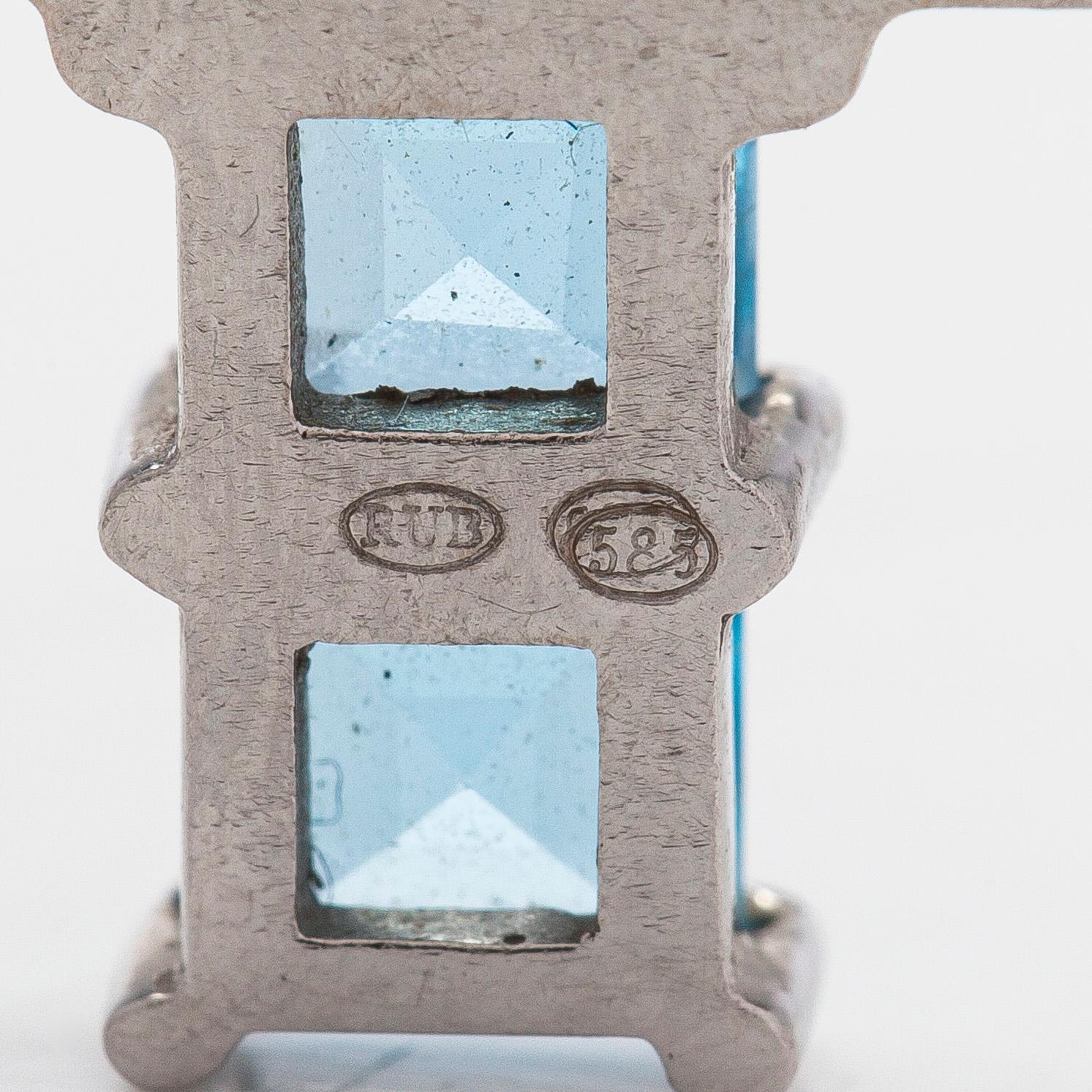 Hänge i form av kors, 14K vitguld med topaser.