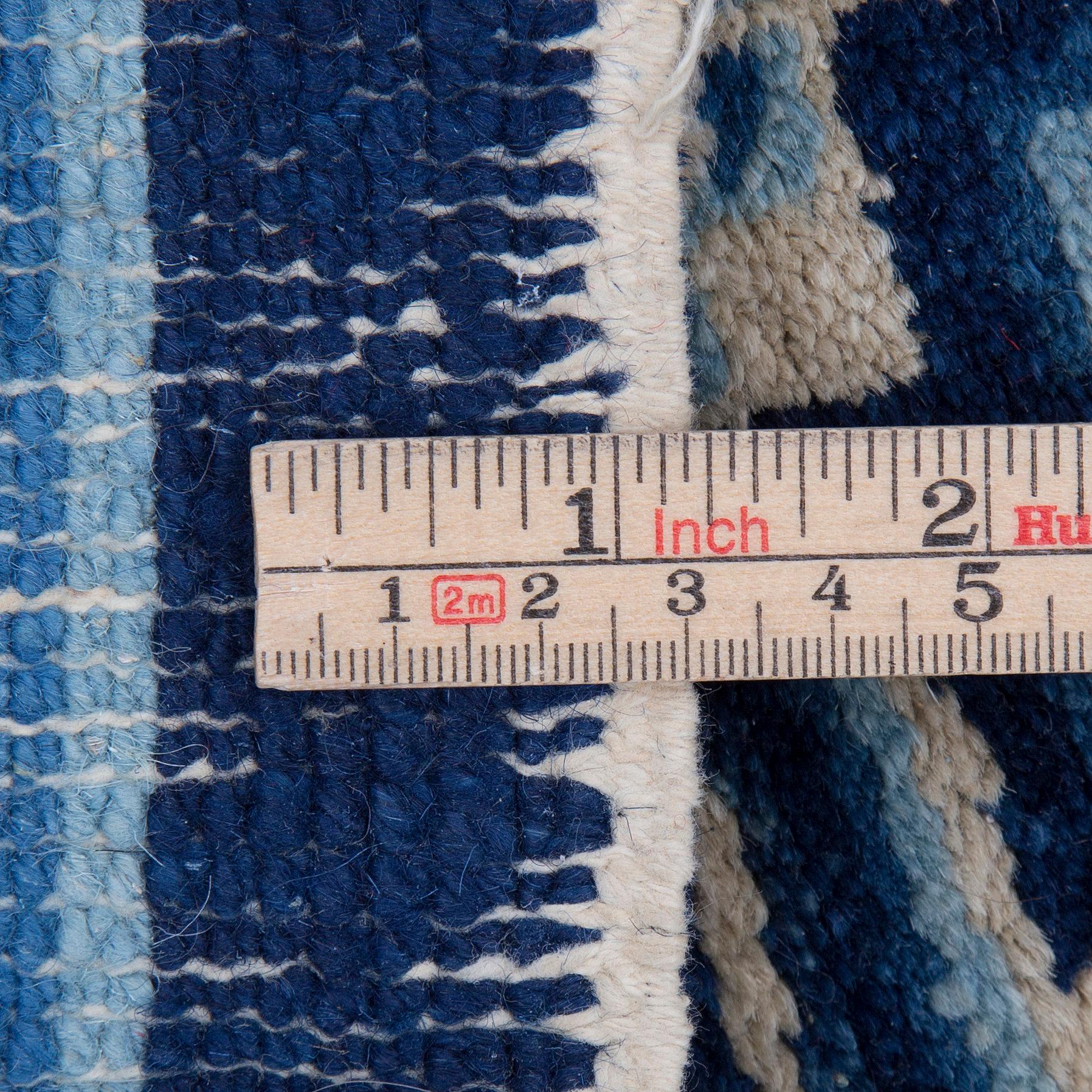 A semi-antique Baotou matto, around 138 x 69 cm ( ca 1,5 cm flat weave at the ends).