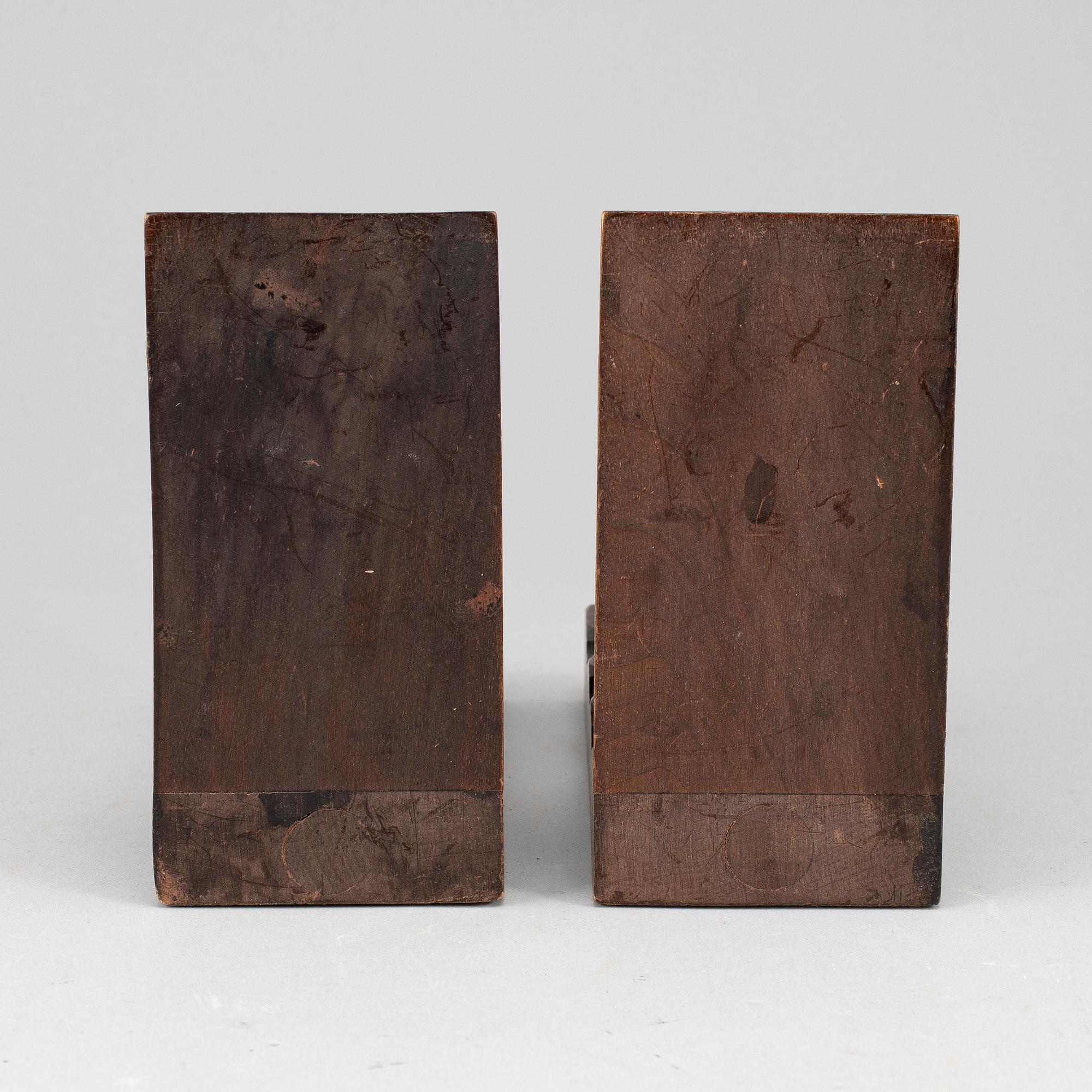 A pair of dark wood book ends, first half of the 20th century.
