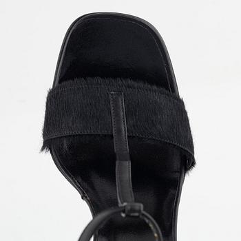 Gucci, a pair of black leather and pony hair shoes, Italian size 36.