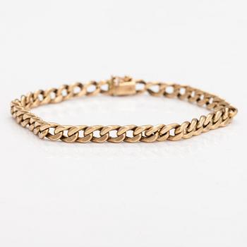 A 14K gold bracelet.