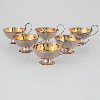 nine silver punsch mugs, Fritz Olsson AB and Ceson, Sweden, 1961, also two silver cups and two silver boxes.