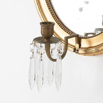 A pair of gilt Gustavian style mirror wall sconces, 20th Century.