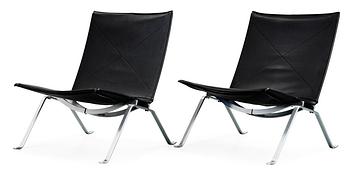 A pair of Poul Kjaerholm 'PK-22' steel and black leather easy chairs, Fritz Hansen, Denmark 1992.