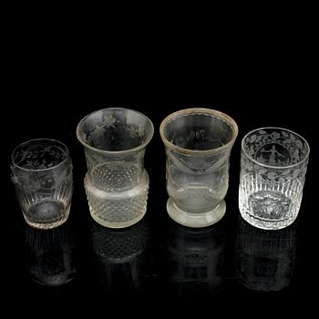 A set of four odd beaker glases, 19th Century.