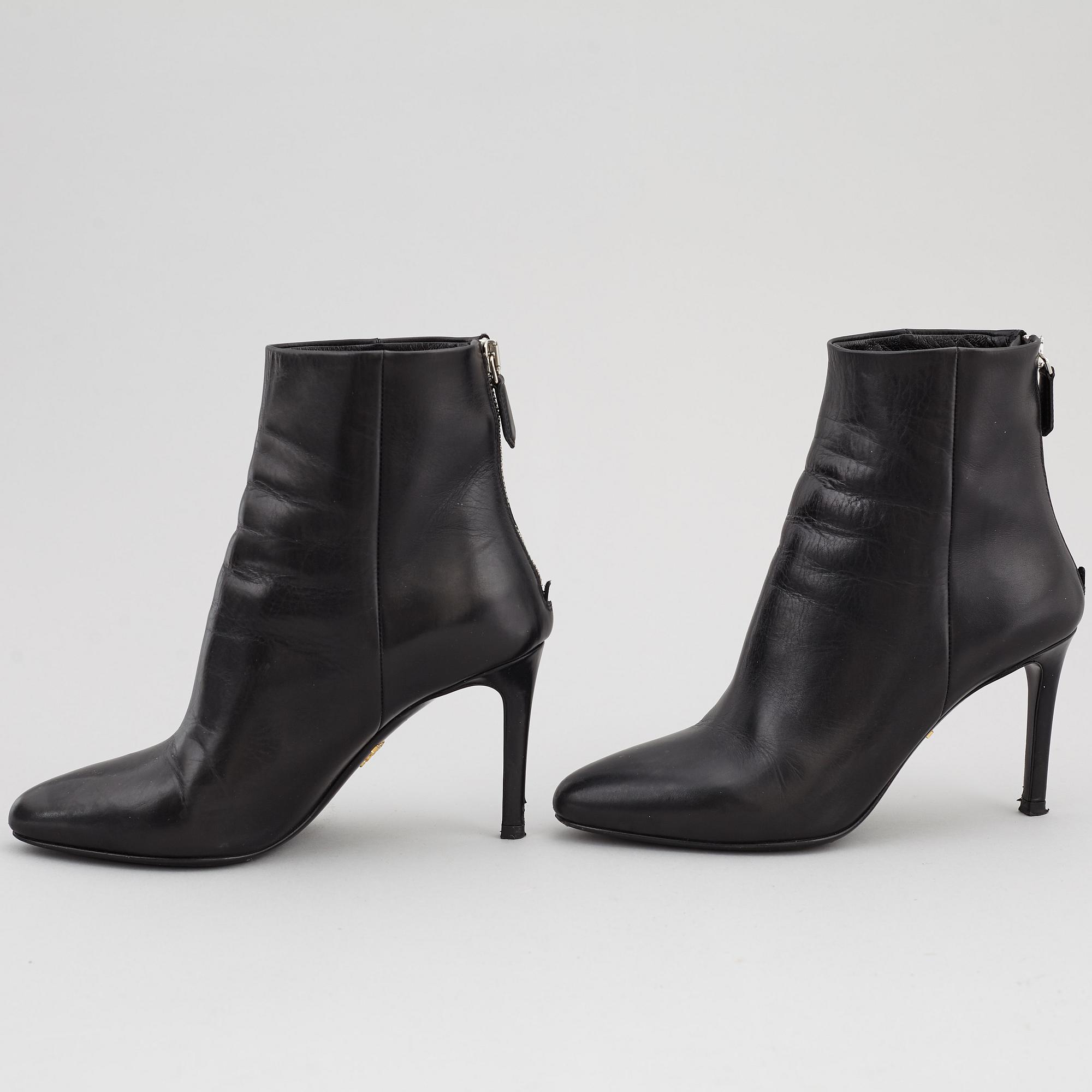 PRADA, a pair of black leather boots, size 35.
