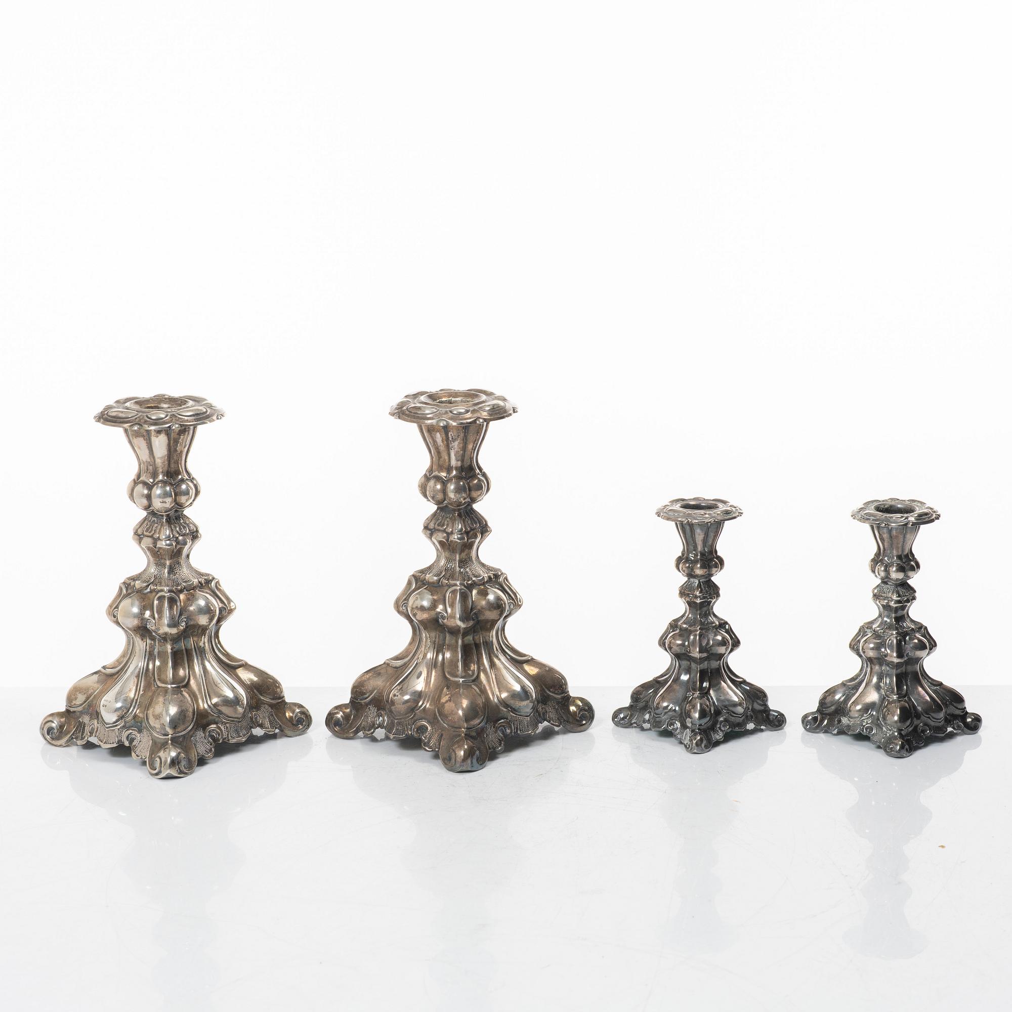 Four Baroque style silver candlesticks, 20th century.