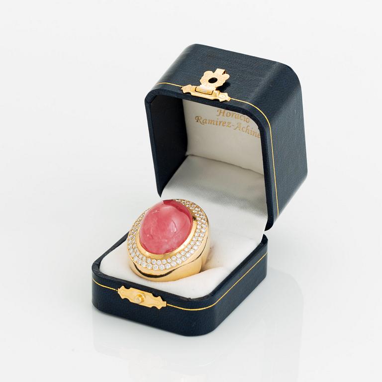 An 18K gold and rhodochrosite Acchinelli ring set with round brilliant-cut diamonds.