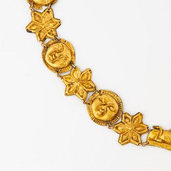 A modern Egyptian-style gold and pearl necklace.