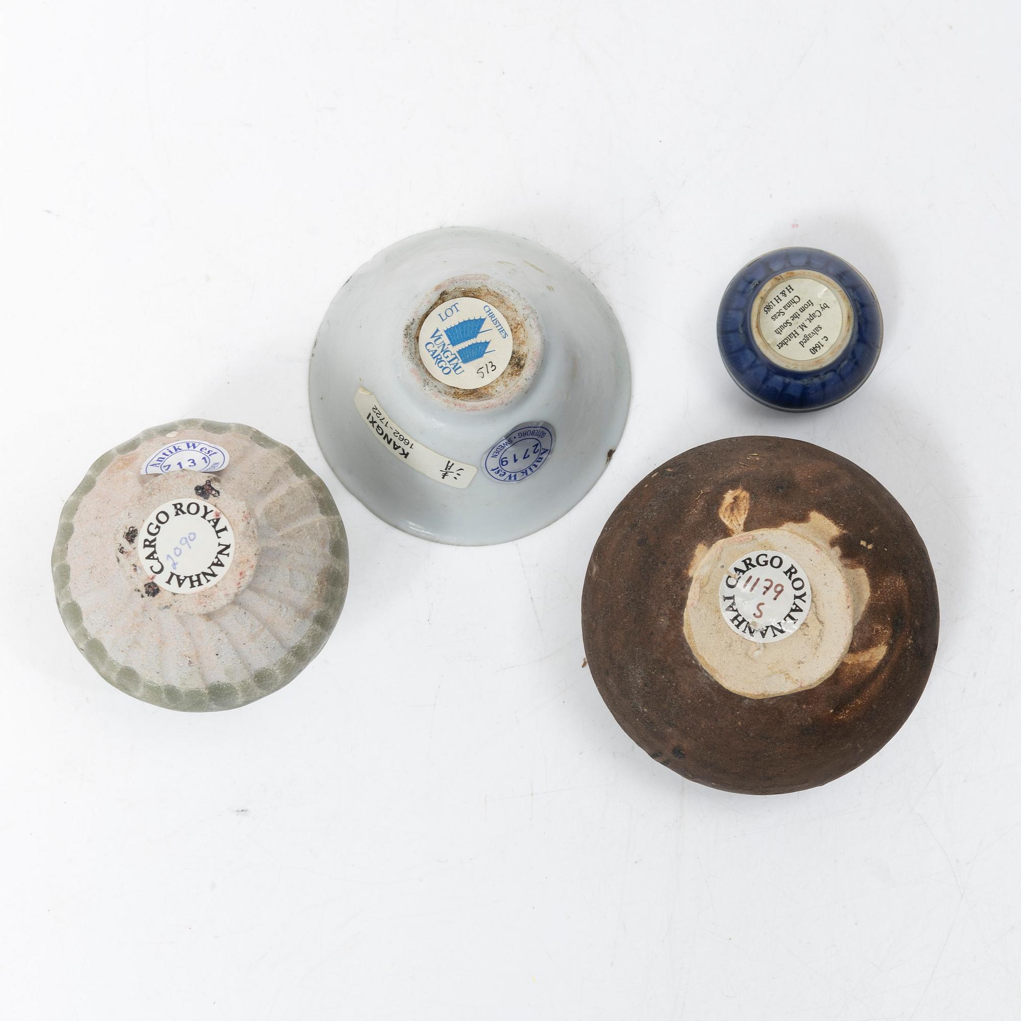 Four ceramic shipwrecked pieces, China, 15th century and 17th century.