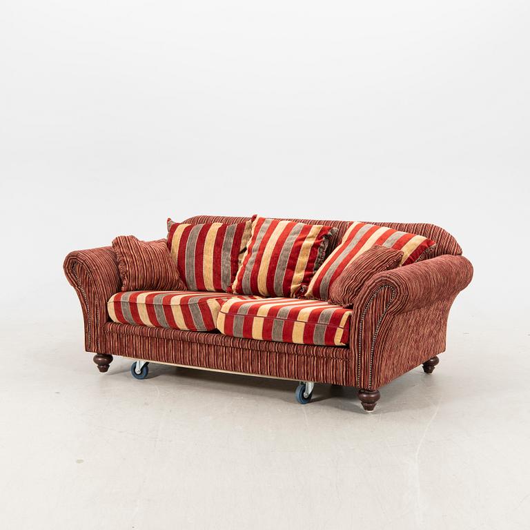A sofa,with pillows. later part of the 20th Century.