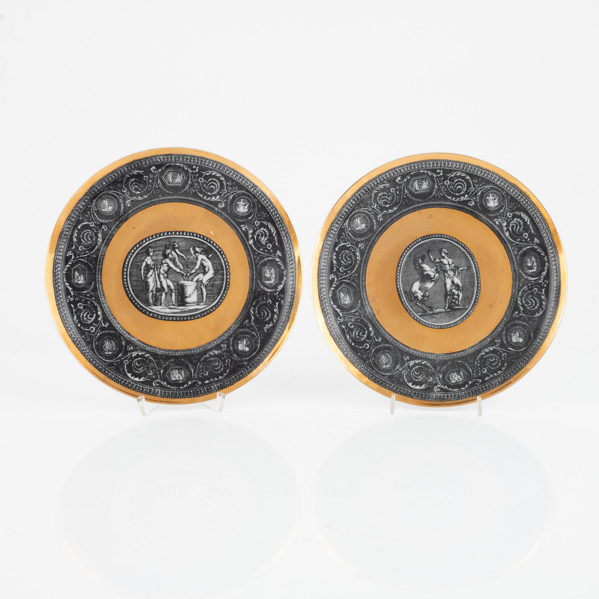 Piero Fornasetti, a pair of porcelain 'Cammei' plates, Fornasetti, Milano.