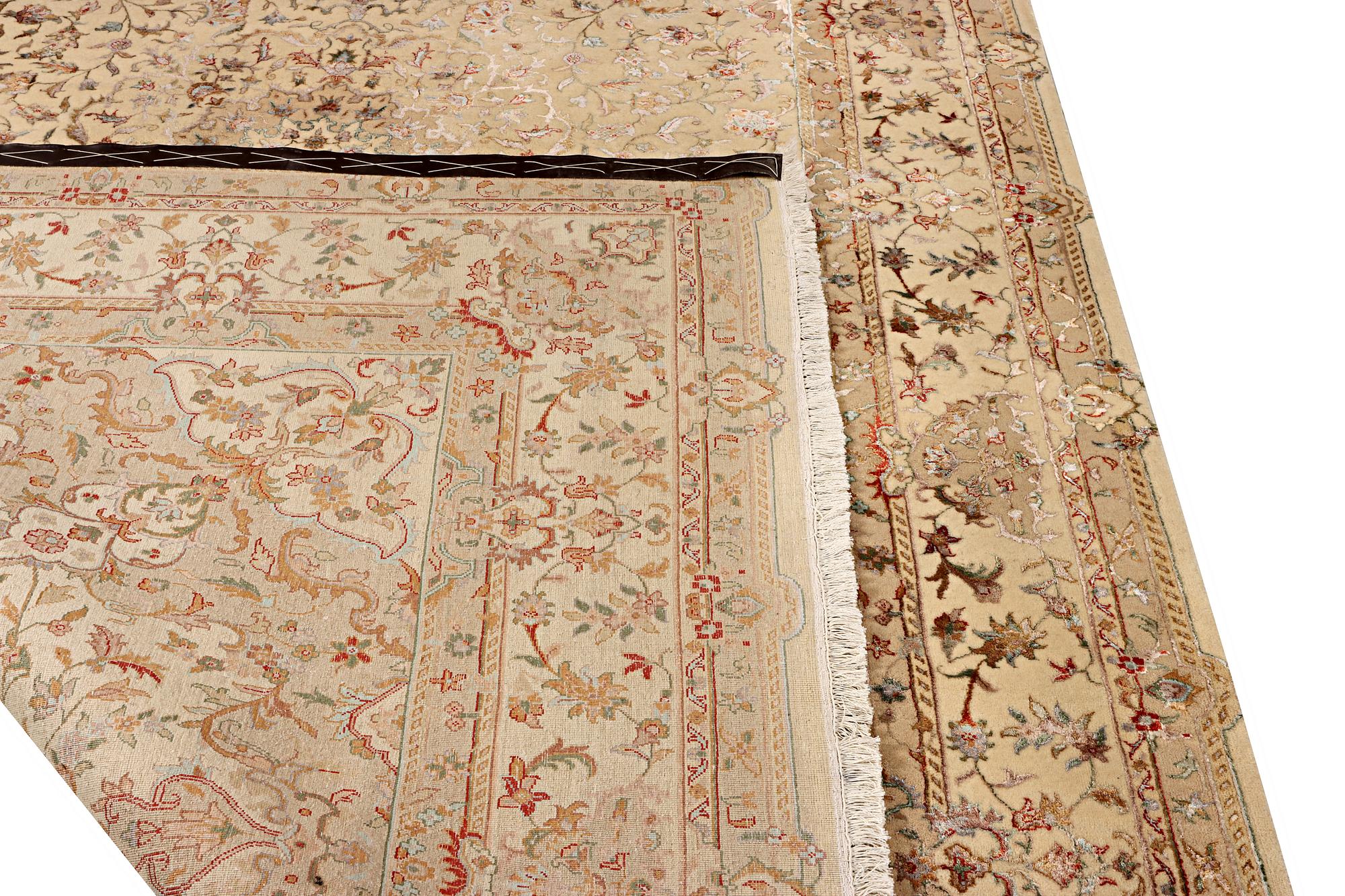 A Tabriz carpet, part silk, c. 311 x 199 cm.
