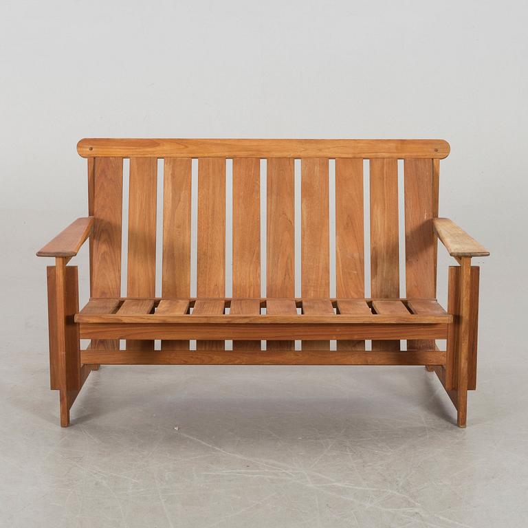 A GARDEN SOFA WITH TABLE, second half of 20th century.