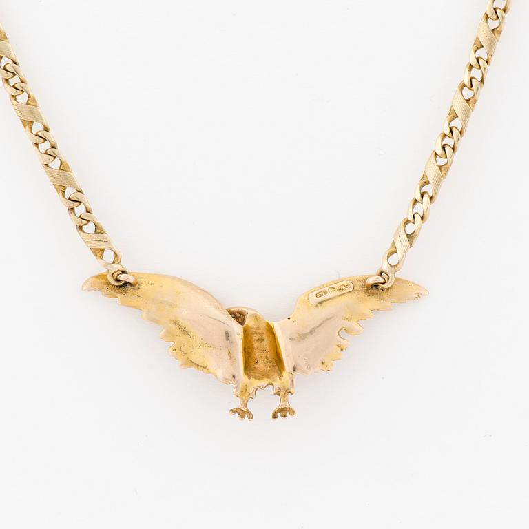 A NECKLACE, 14K gold, small brilliant cut diamond.