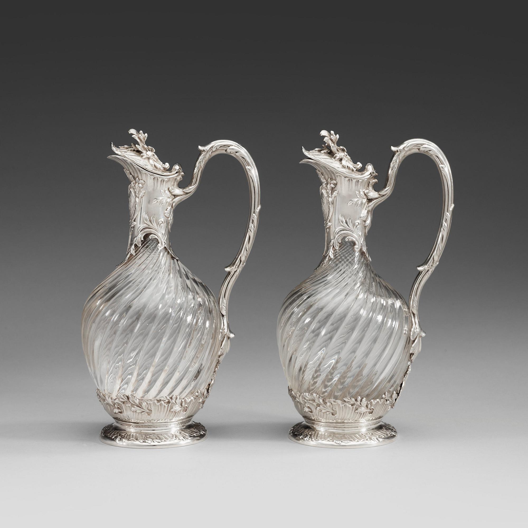 A pair of French late 19th century silver and glass wine-flagons.