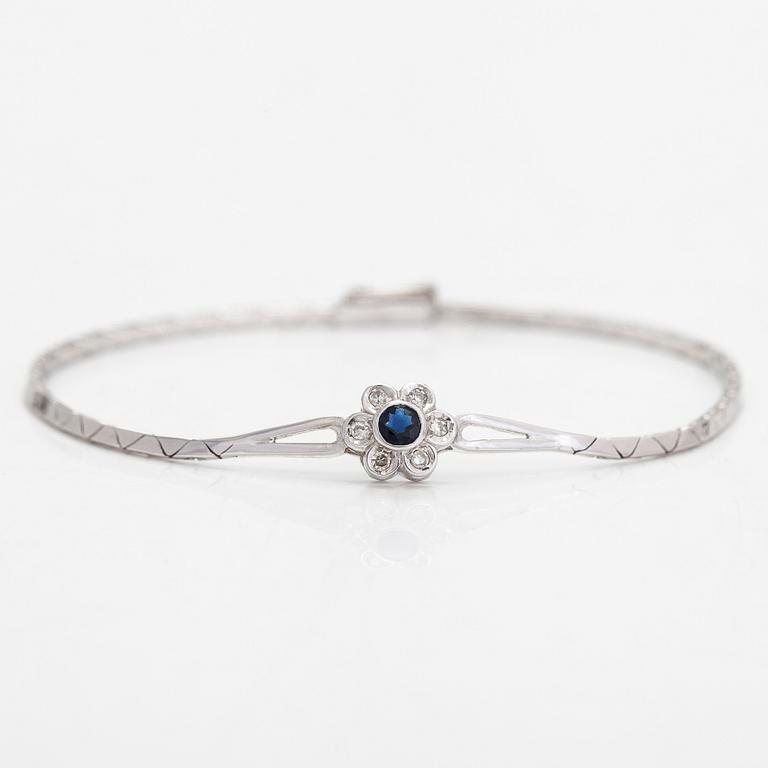 A 14K gold bracelet with sapphire and diamonds totalling approx. 0.12 ct. Finnish import hallmark.