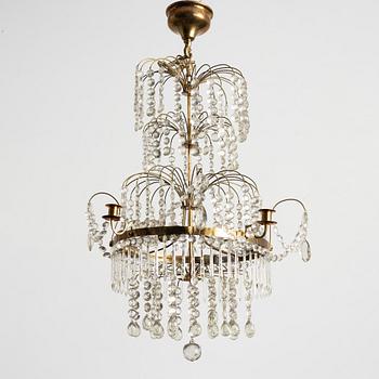 A four-light Gustavian-style chandelier, circa 1900.