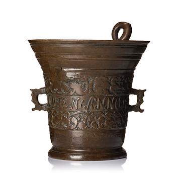 189. A Swedish late baroque bronze mortar and pestle, dated 1759.