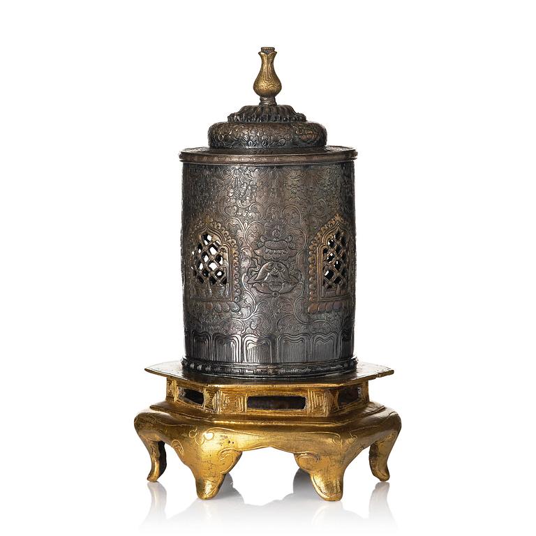 A silvered brass prayer container, Tibet, 20th century.