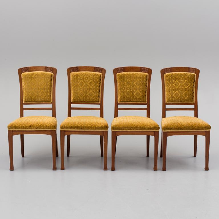 An early 20th century table with 4 chairs.