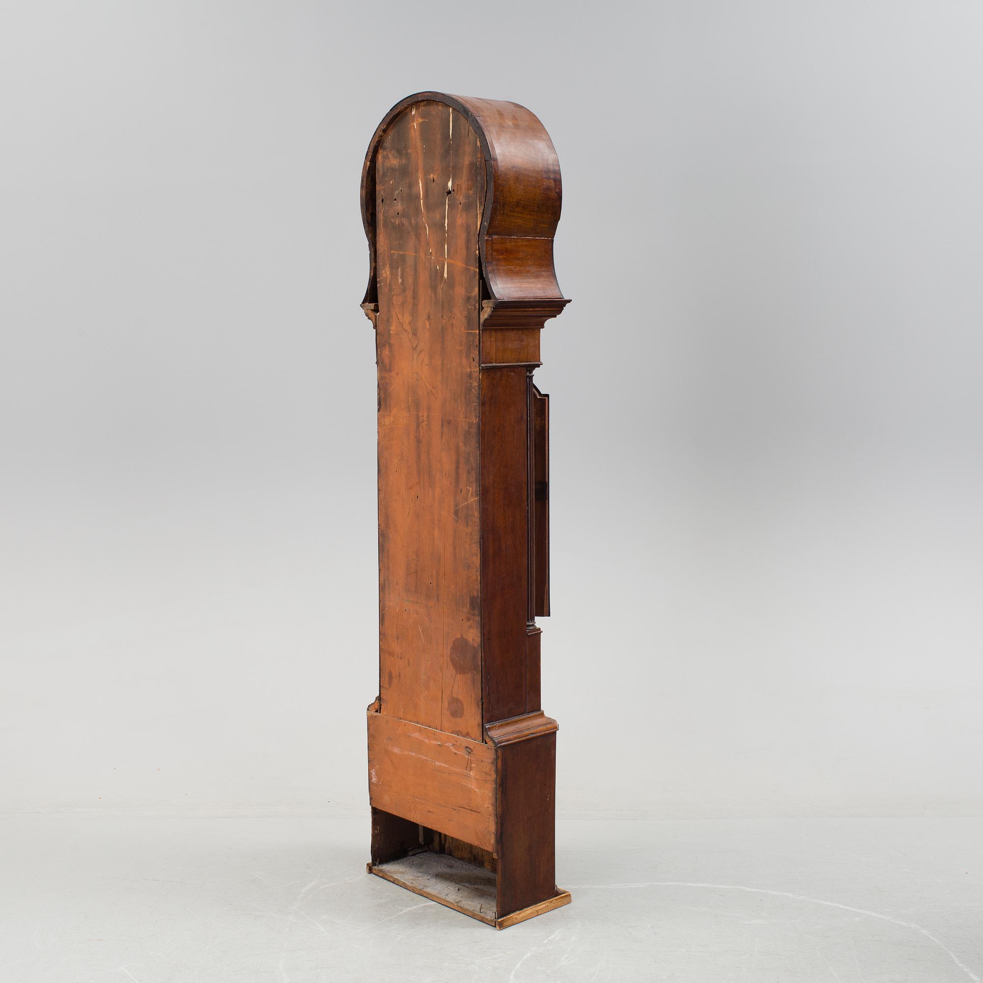 A 19th century Longcase Clock with arched brass dial inscribed Thomas Atkinson, Ormskirk, England.