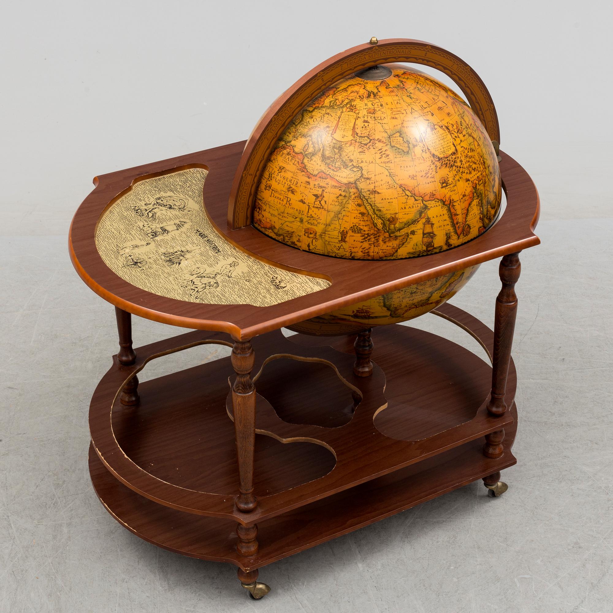 A globe shaped drinks cabinet, circa 2000.