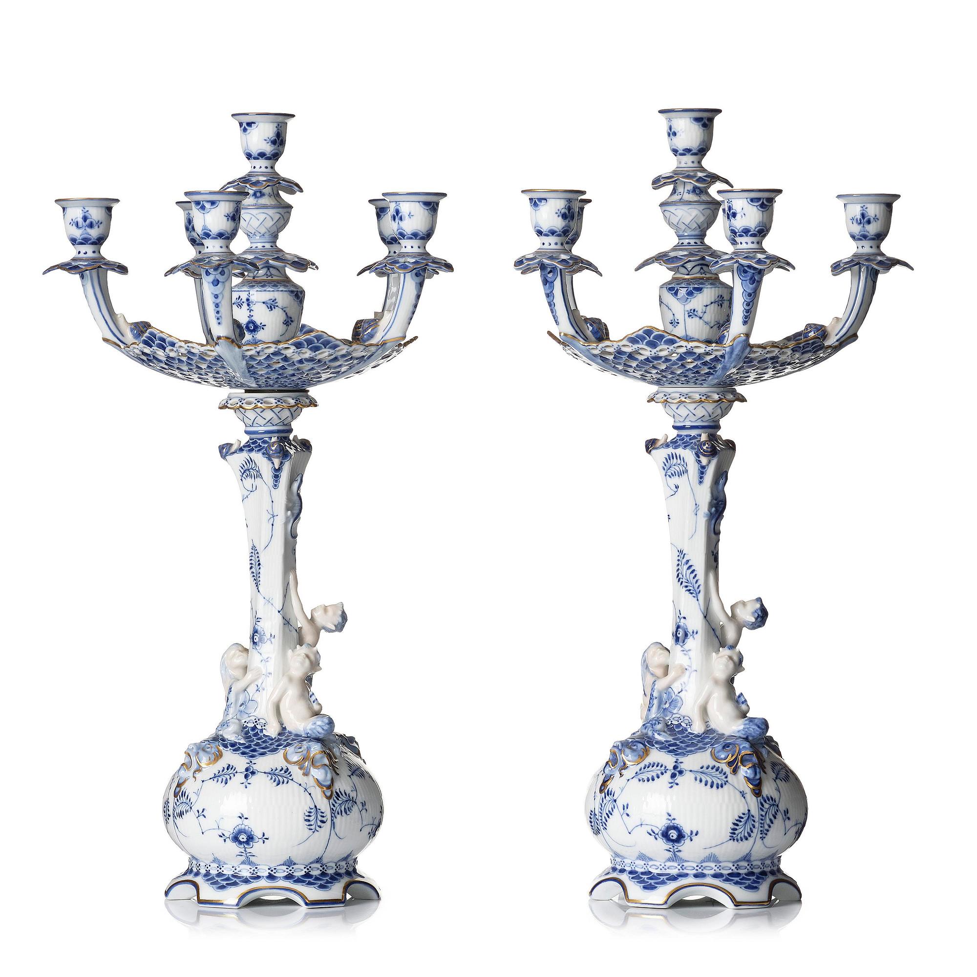 A pair of Royal Copenhagen 'Musselmalet' / 'blue fluted full lace' six-light candelabras, Denmark, 1898-1923.