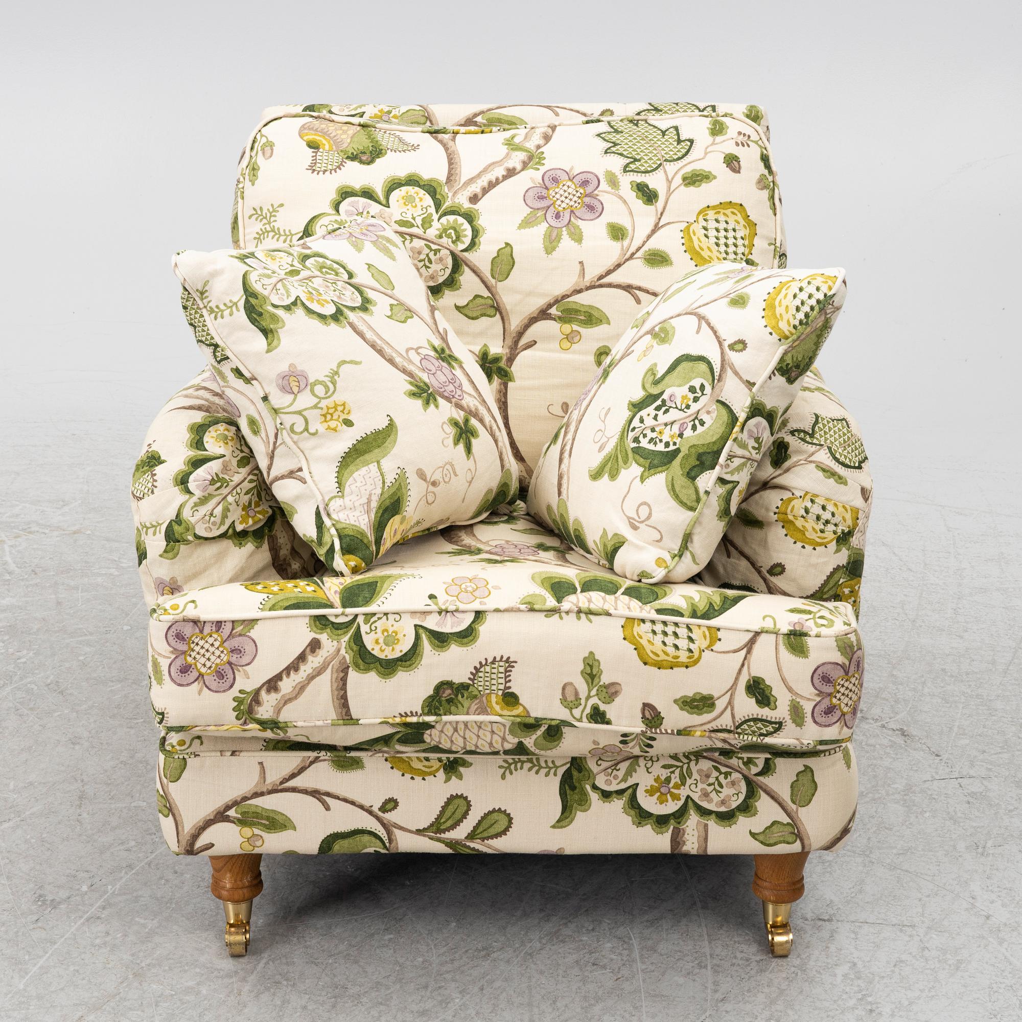 A 'Howard' armchair with footstool, Englesson.