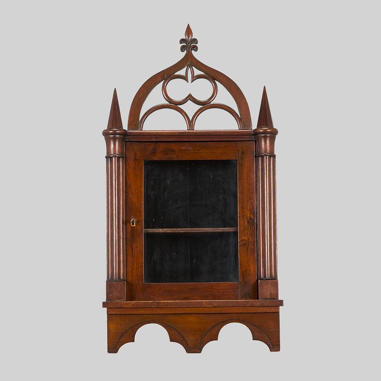 A mid-19th-century wall cabinet.