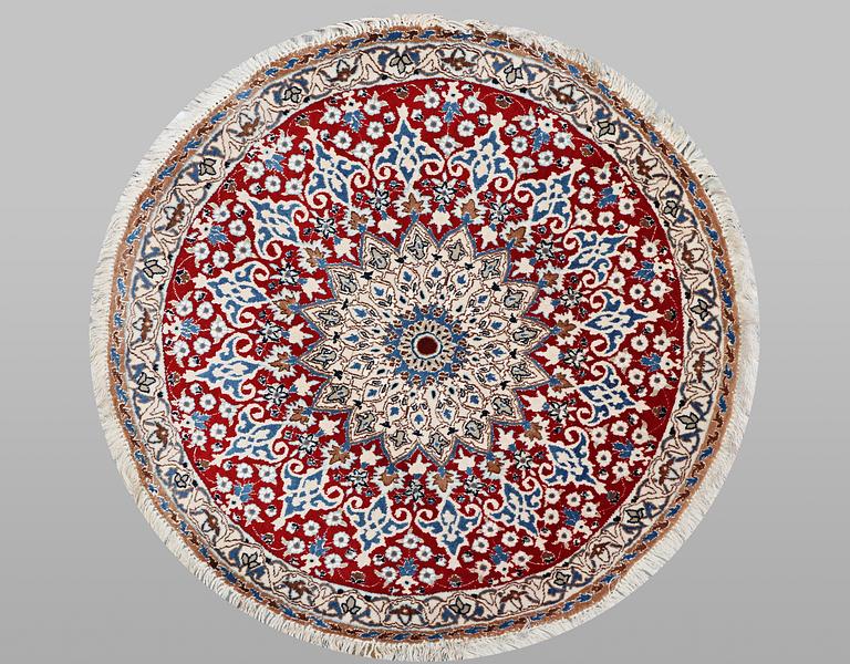 A Nain part silk rug, c. 101 x 101 cm.