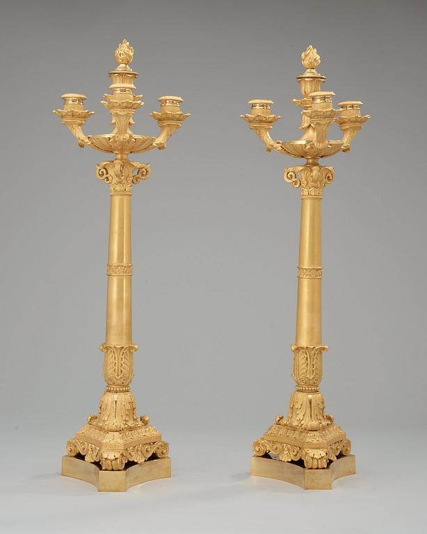 A pair of French Empire early 19th century four-light candelabra.