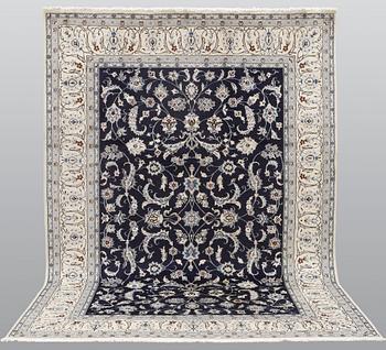 A carpet, Nain, part silk, ca 350 x 247 cm.