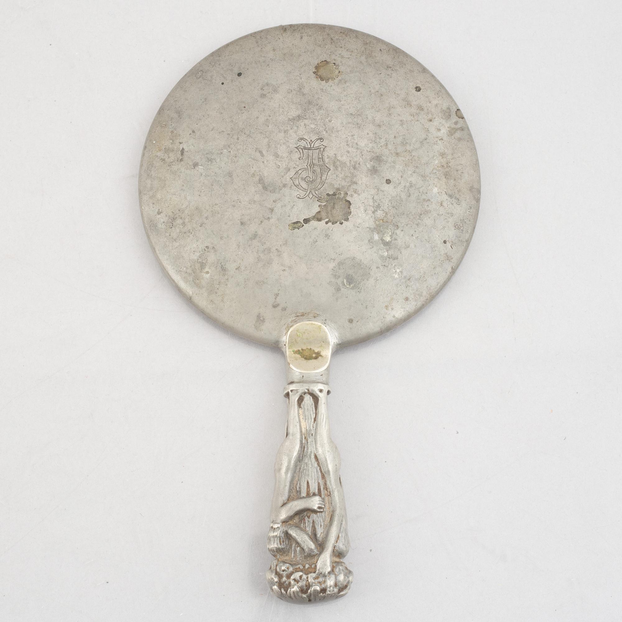 A pewter hand mirror, model A148, Firma Svenskt Tenn, Stockholm 1920's/30s.
