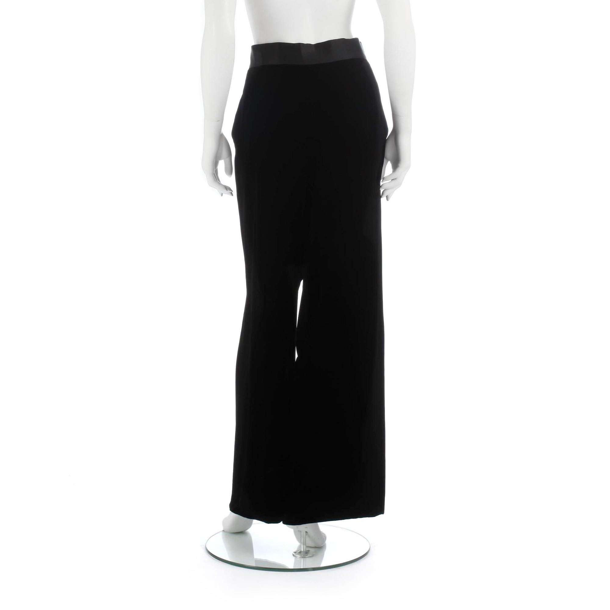 CHANEL, a pair of black velvet pants.