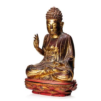 A large gilt and lacquered figure of a seated buddha, Qing dynasty, 19th Century.