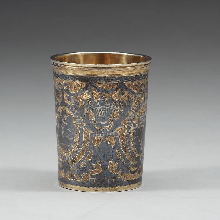 A Russian eraly 19th century parcel-gilt and niello beaker, marked Moscow 1804.