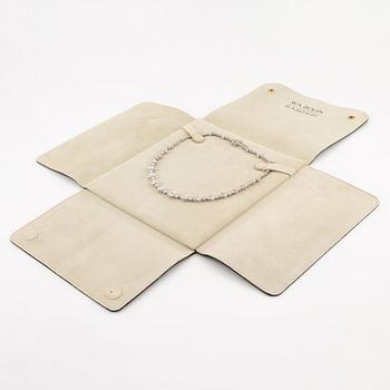 A platinum necklace set with navette-, pear- and round-brilliant-cut diamonds.