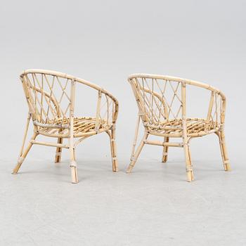 A rattan and bamboo sofa and two armchairs, second half of the 20th Century.