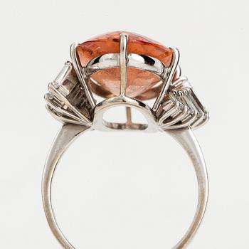 A topaz and diamond cocktail ring.